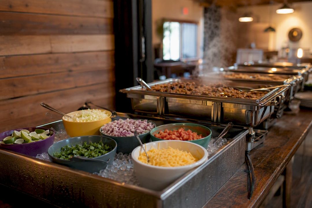 Taco bar line with chafing dishes and ice trays