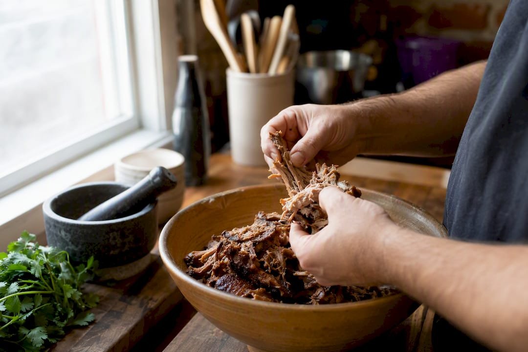 Hand-pulled slow-cooked carnitas pork close-up