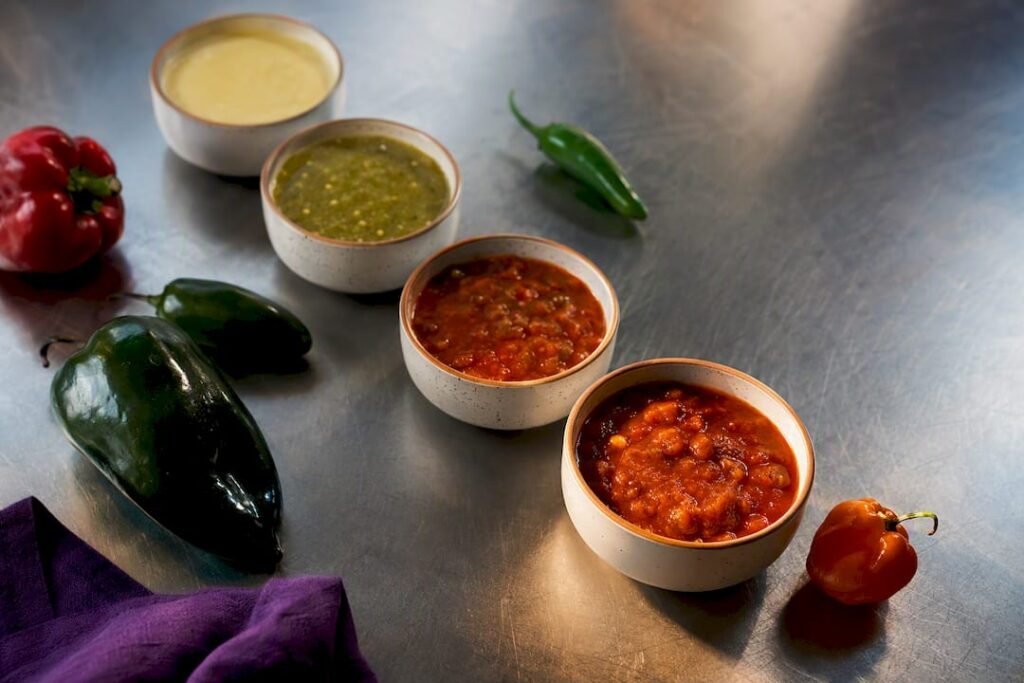 Four salsa bowls showing escalating heat levels