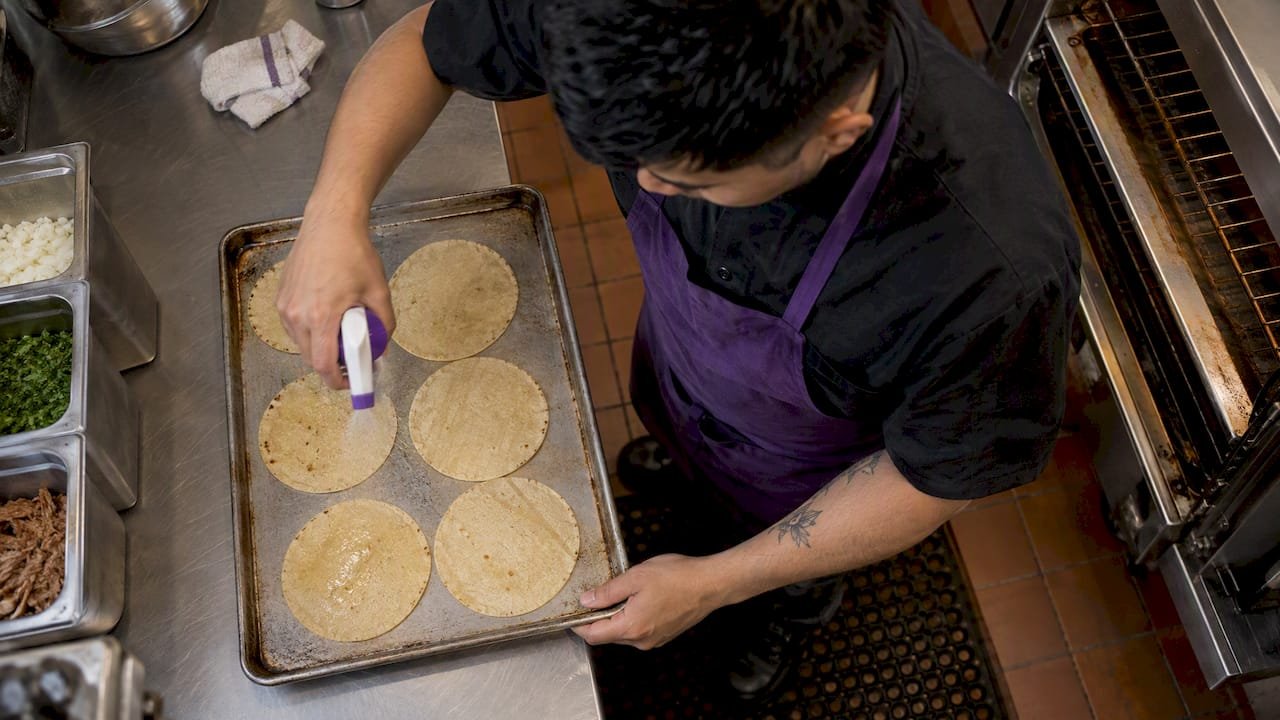 Corn tortillas lightly misted with water