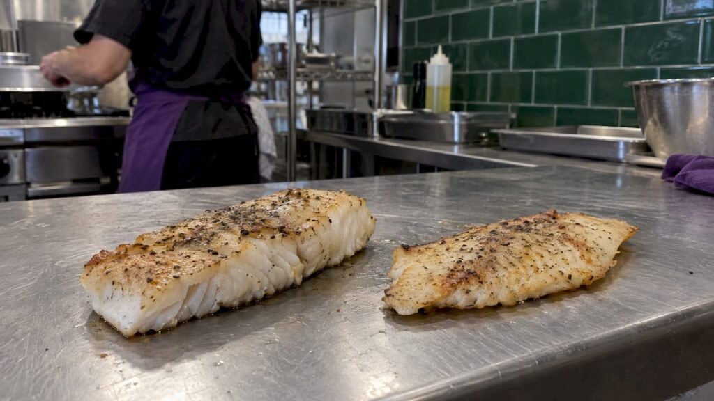 Cooked whitefish and tilapia fillets side by side
