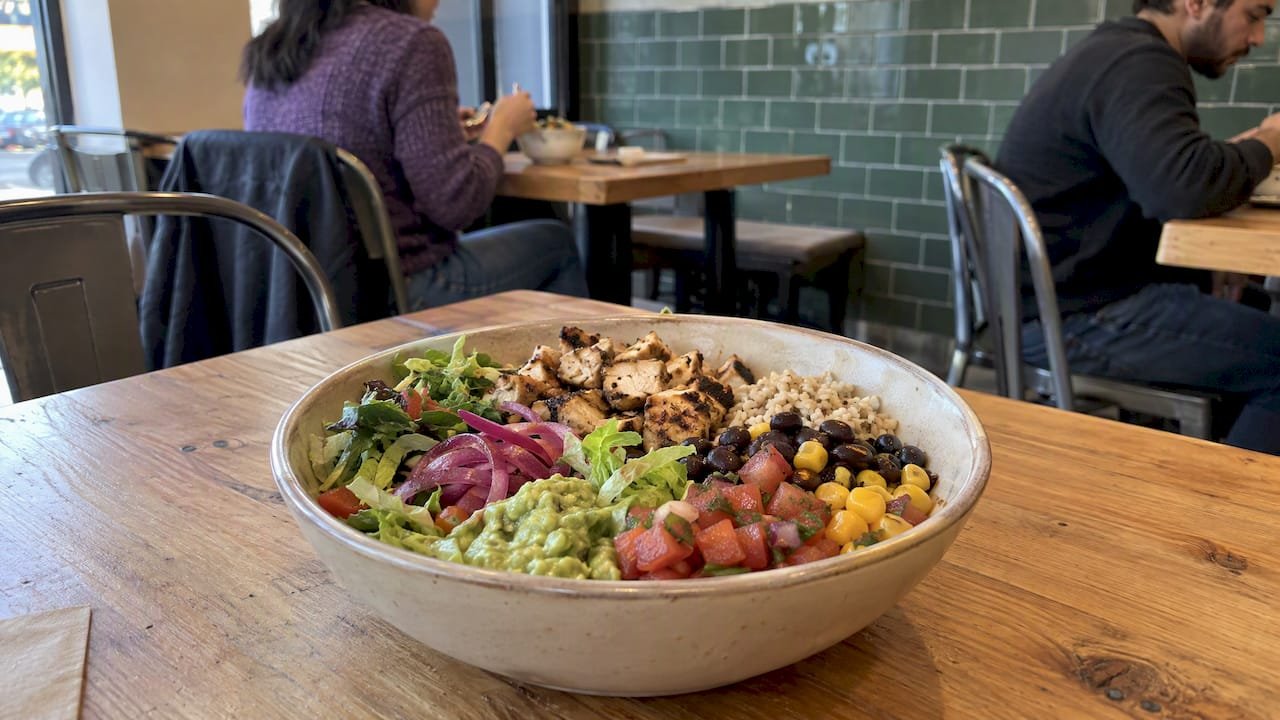 Balanced Mexican lunch bowl with vegetables and beans