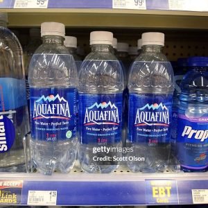 CHICAGO - JULY 27:  Bottles of Pepsi's Aquafina water sit on a shelf next to other brands of bottled water at a Walgreens store July 27, 2007 in Chicago, Illinois.  Pepsi announced today that the labels on its Aquafina water will be changed to say the product is tap water. Coke admitted in 2004 that its Dasani water was tap water.  (Photo by Scott Olson/Getty Images)